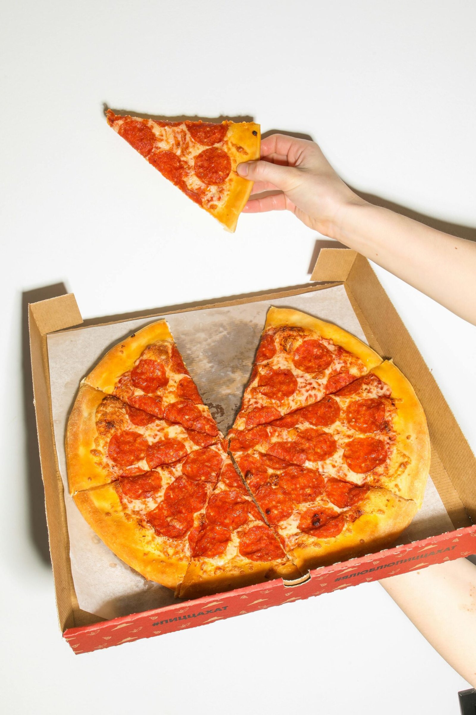 Freshly baked pepperoni pizza in a box, perfect for a delicious meal.